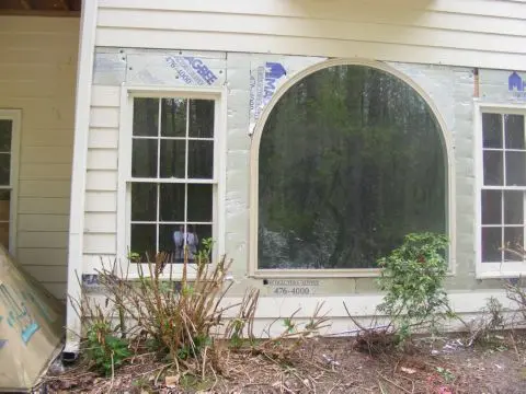 A house with a window that has been painted white.
