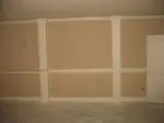 A room with some white walls and a wall that has been painted.