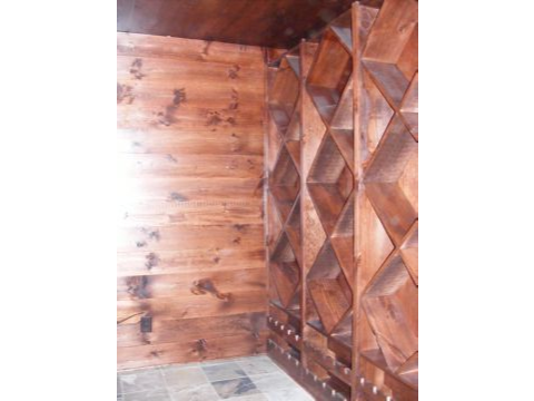 A room with wood paneling and tile floor.
