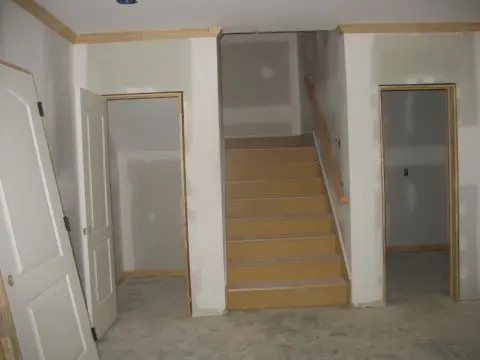 A room with stairs and walls in it