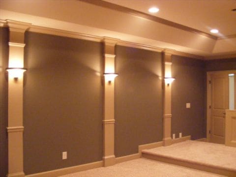 A room with brown walls and white trim.