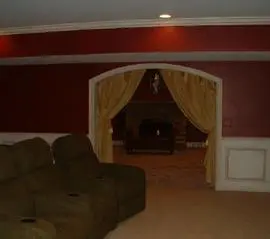 A living room with couches and a couch in the middle of the room