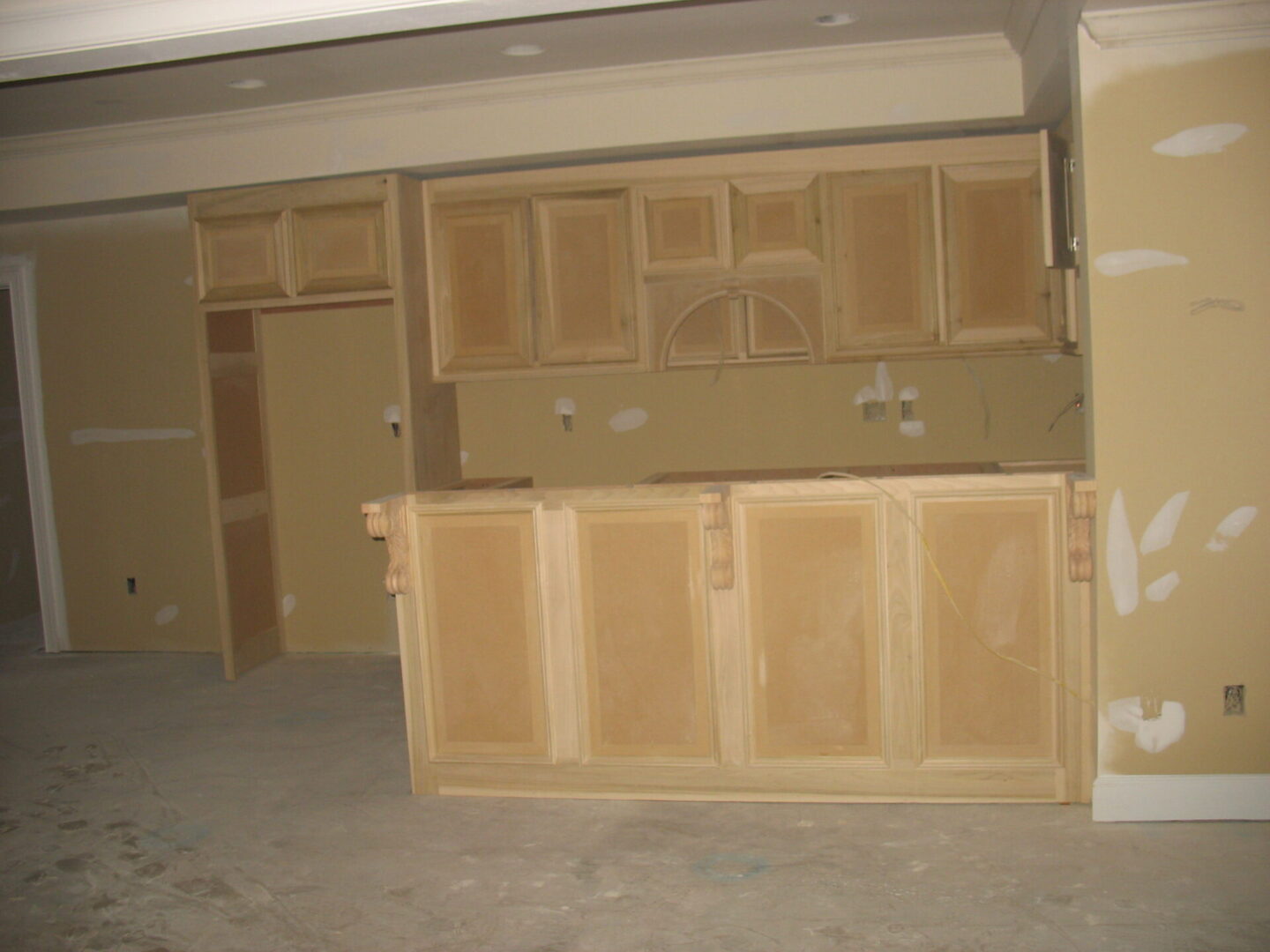 A room with many cabinets and doors in it