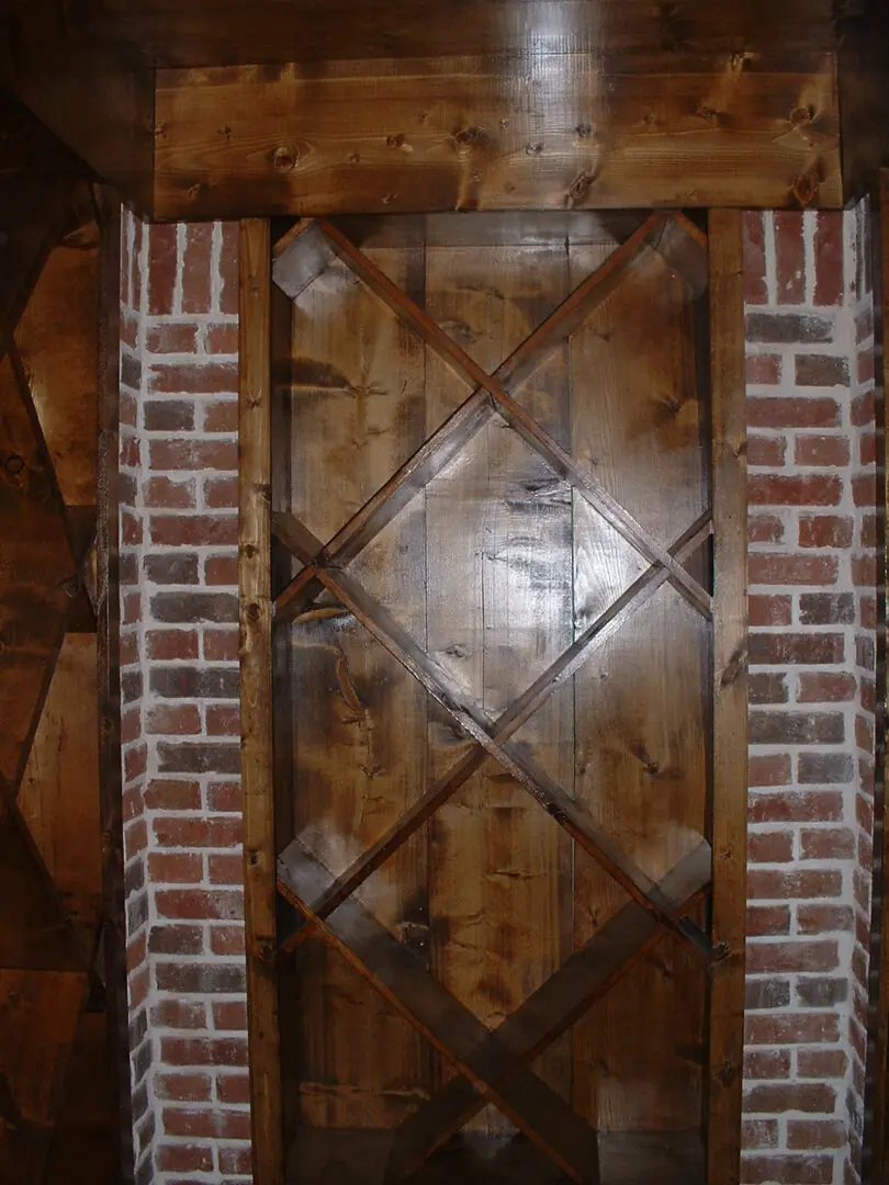 A door with brick and wood trim in the center.