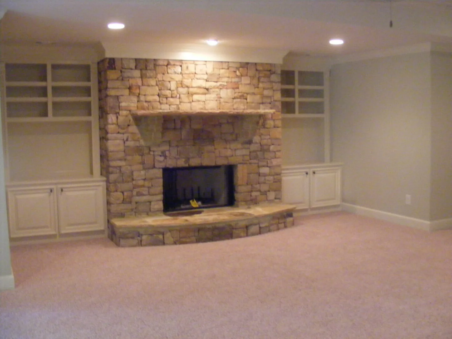 Custom basement design with built-in shelving